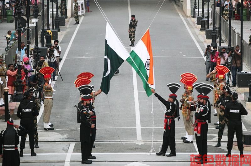 Pakistani Rangers (wearing black uniforms) and Indian Border Security Force (BSF) officers lower their national flags during parade on the Pakistan's 72nd Independence Day, at the Pakistan-India joint check-post at Wagah border, near Lahore. PHOTO: REUTERS/FILE